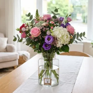 Colourful seasonal bouquet in a glass vase