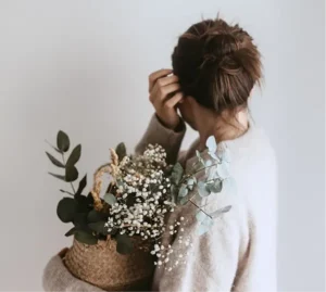 Woman carrying flowers