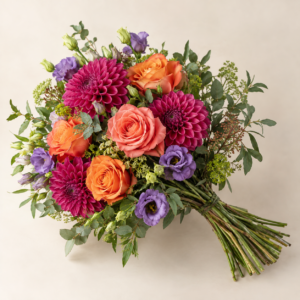 Bright bouquet of orange roses, magenta dahlias and purple flowers